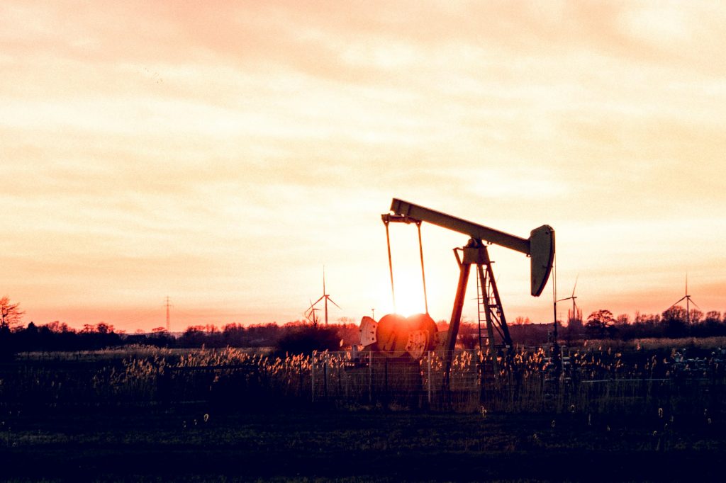 Oil pump operating in a Texas field at sunset